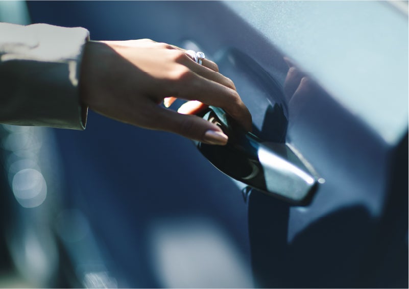 A hand gracefully grips the Light Touch Handle of a 2023 Lincoln Aviator® SUV to demonstrate its ease of use | McKie Lincoln, Inc. in Rapid City SD