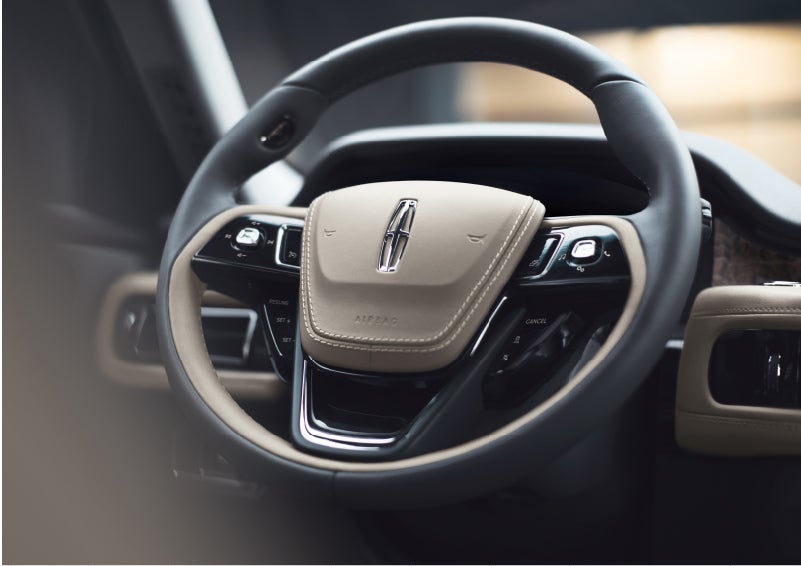 The intuitively placed controls of the steering wheel on a 2023 Lincoln Aviator® SUV | McKie Lincoln, Inc. in Rapid City SD